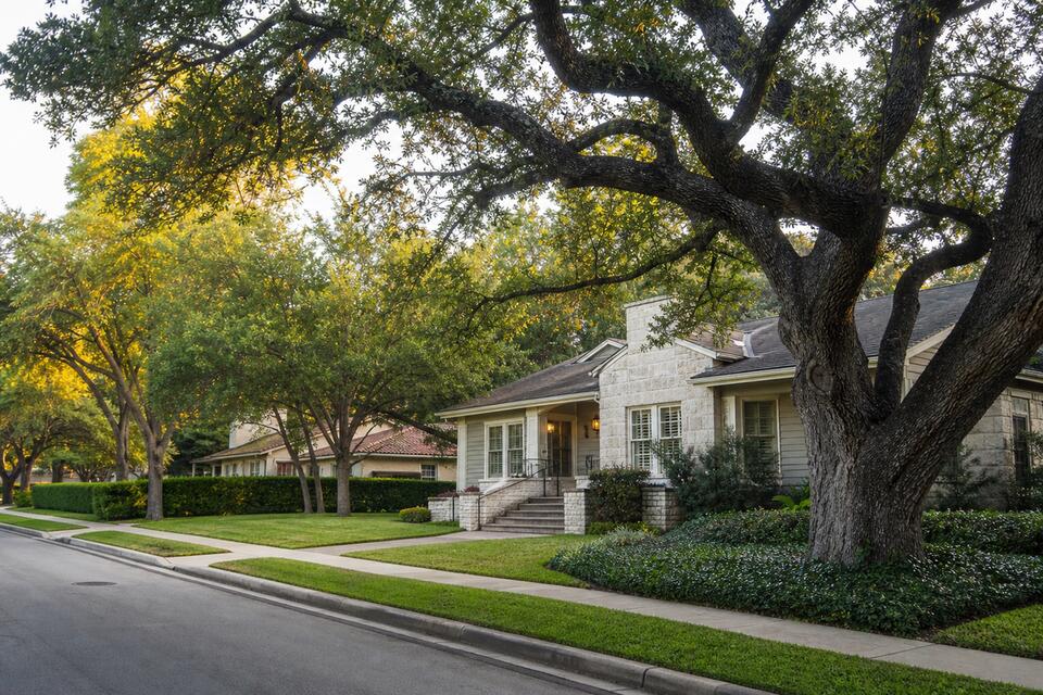 Historic Alamo Heights pier and beam home on tree-lined street