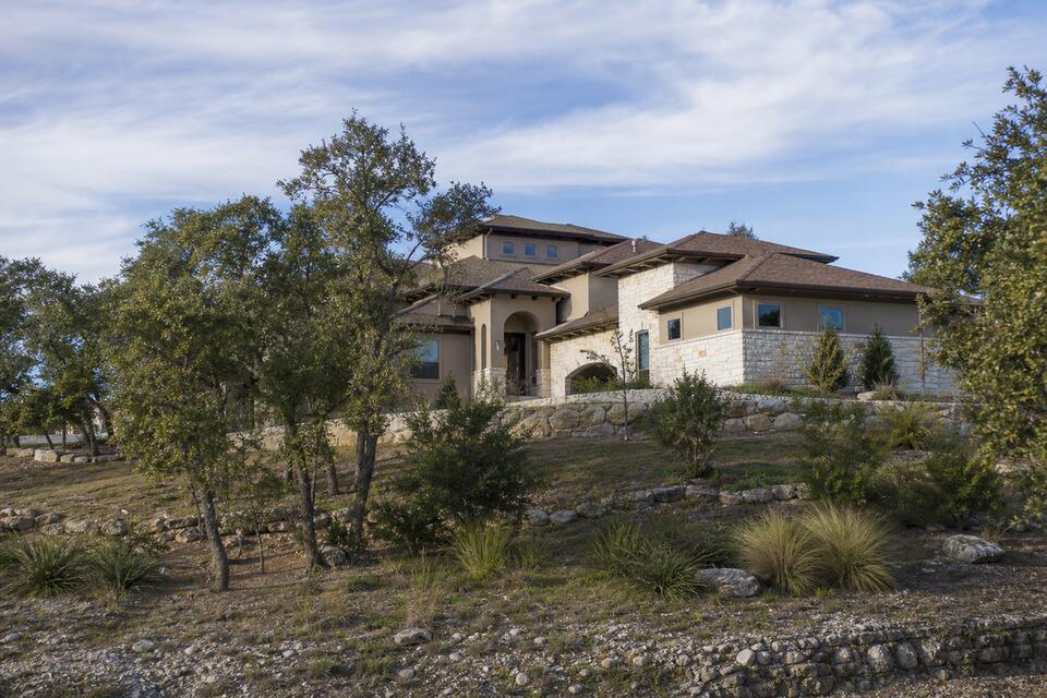 Helotes Texas Hill Country home with limestone facade